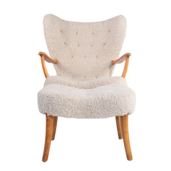 #310 Wingback Lounge Chair and Foot Stool “Pragh”  in Sheepskin by ip Madsen and Acton Schubell,